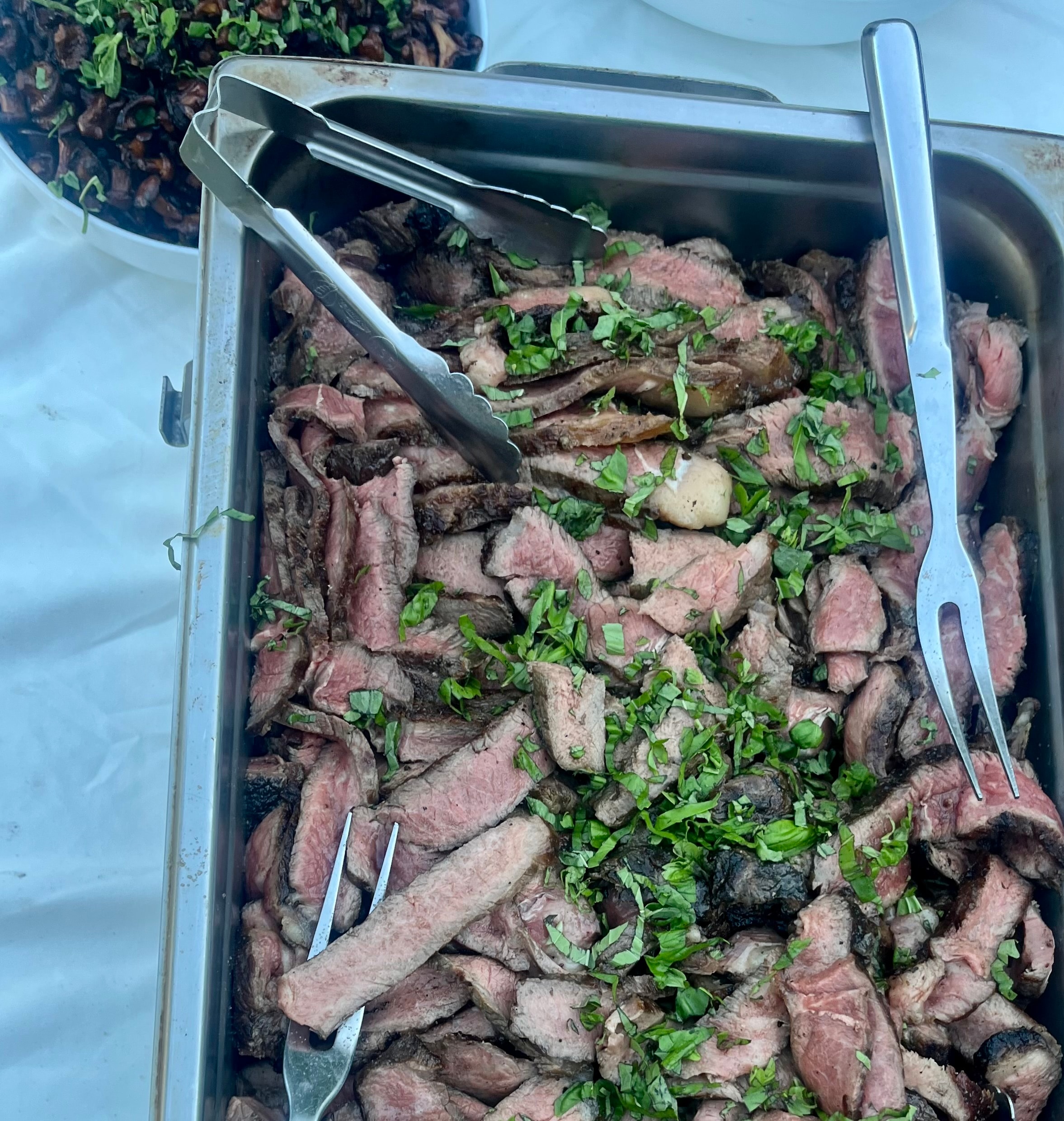 Sliced grilled steak with herbs
