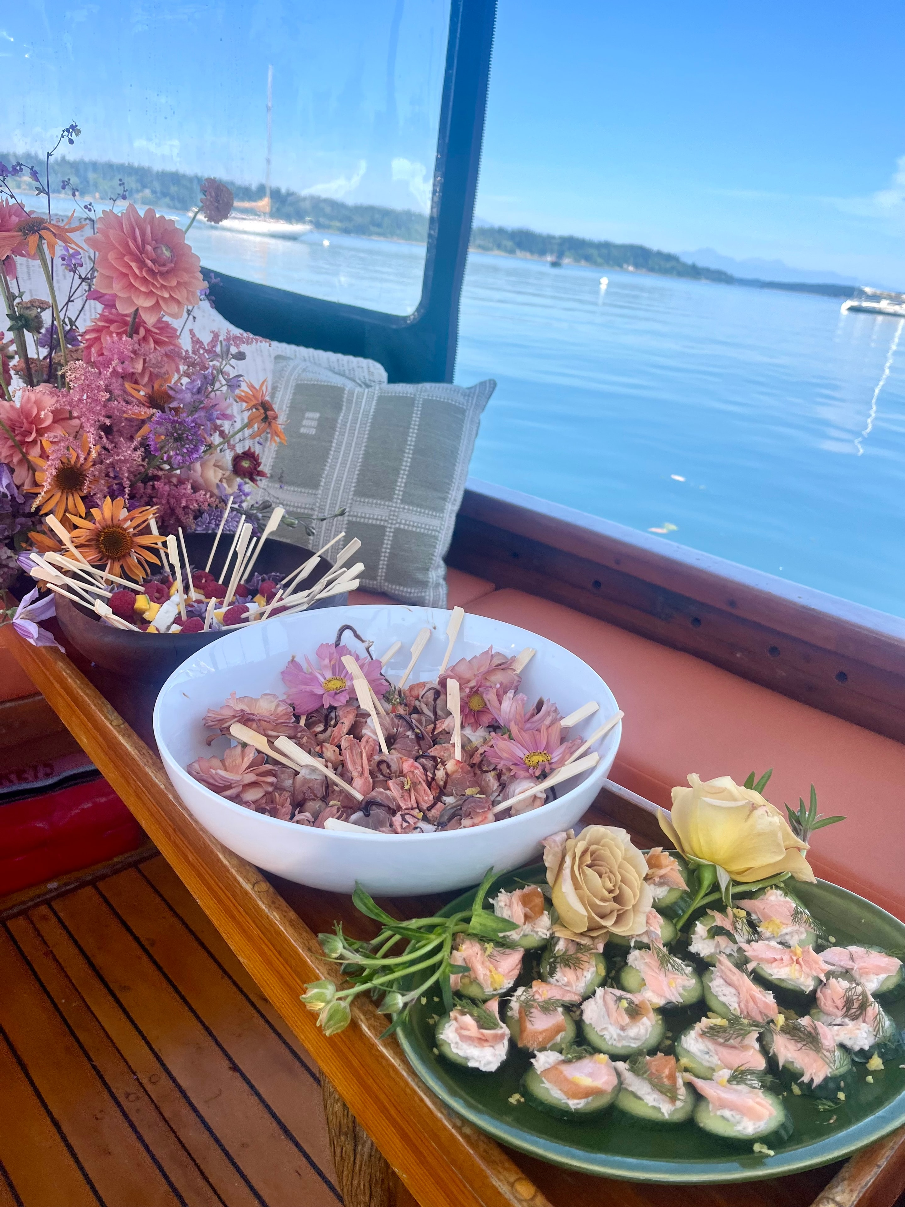 Catered appetizers on a boat with water views