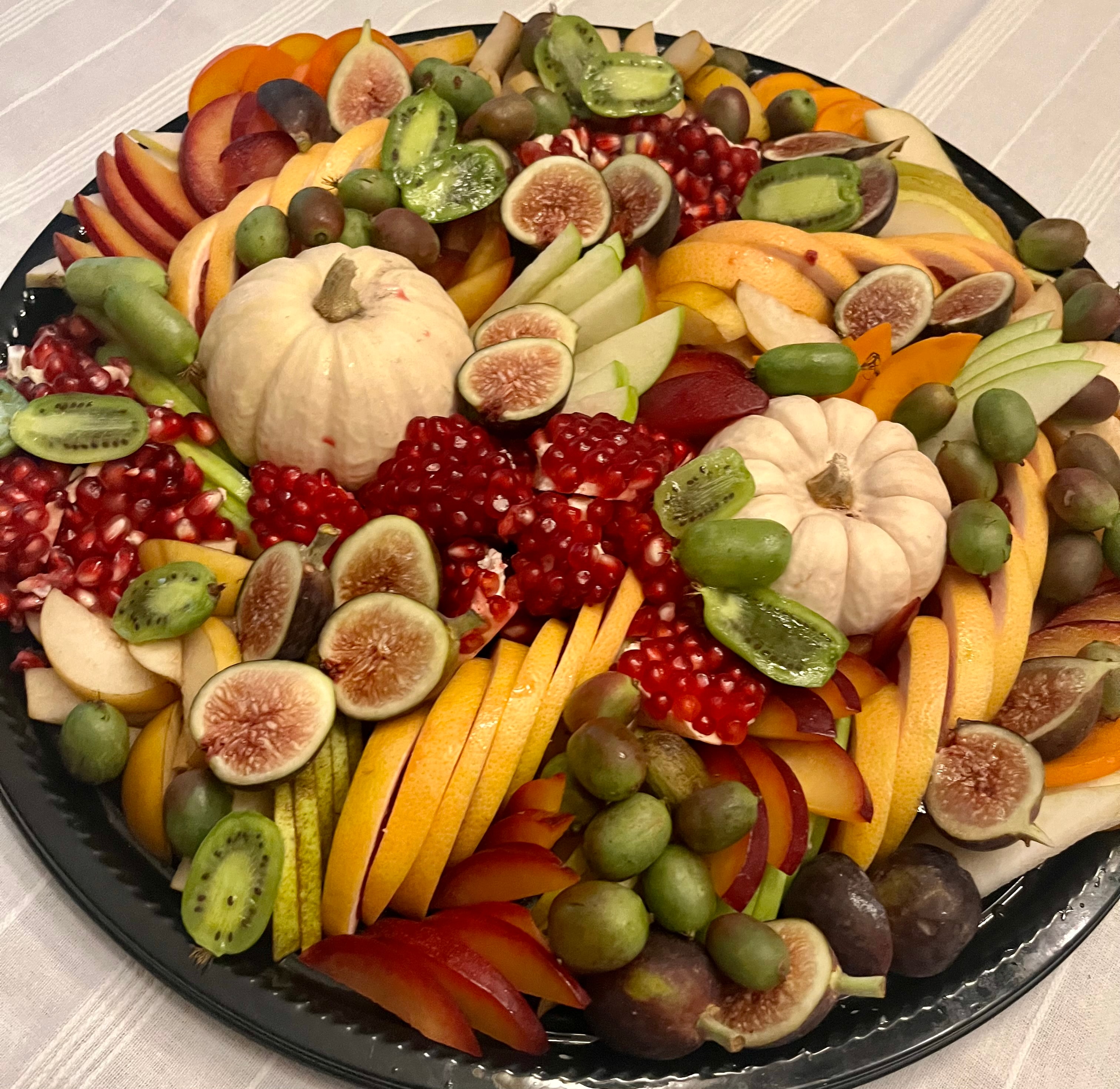 Seasonal fruit platter with figs and pomegranate