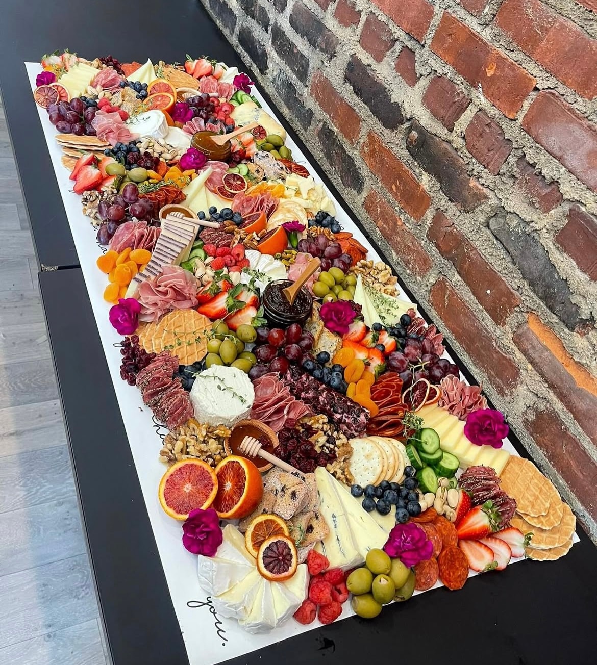 Elaborate charcuterie board with flowers