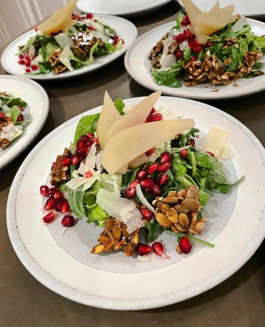 Arugula salad with pomegranate pear and pepitas