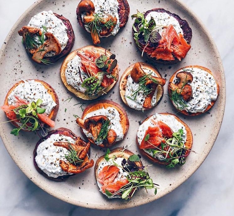Smoked salmon and mushroom blinis with cream cheese and microgreens