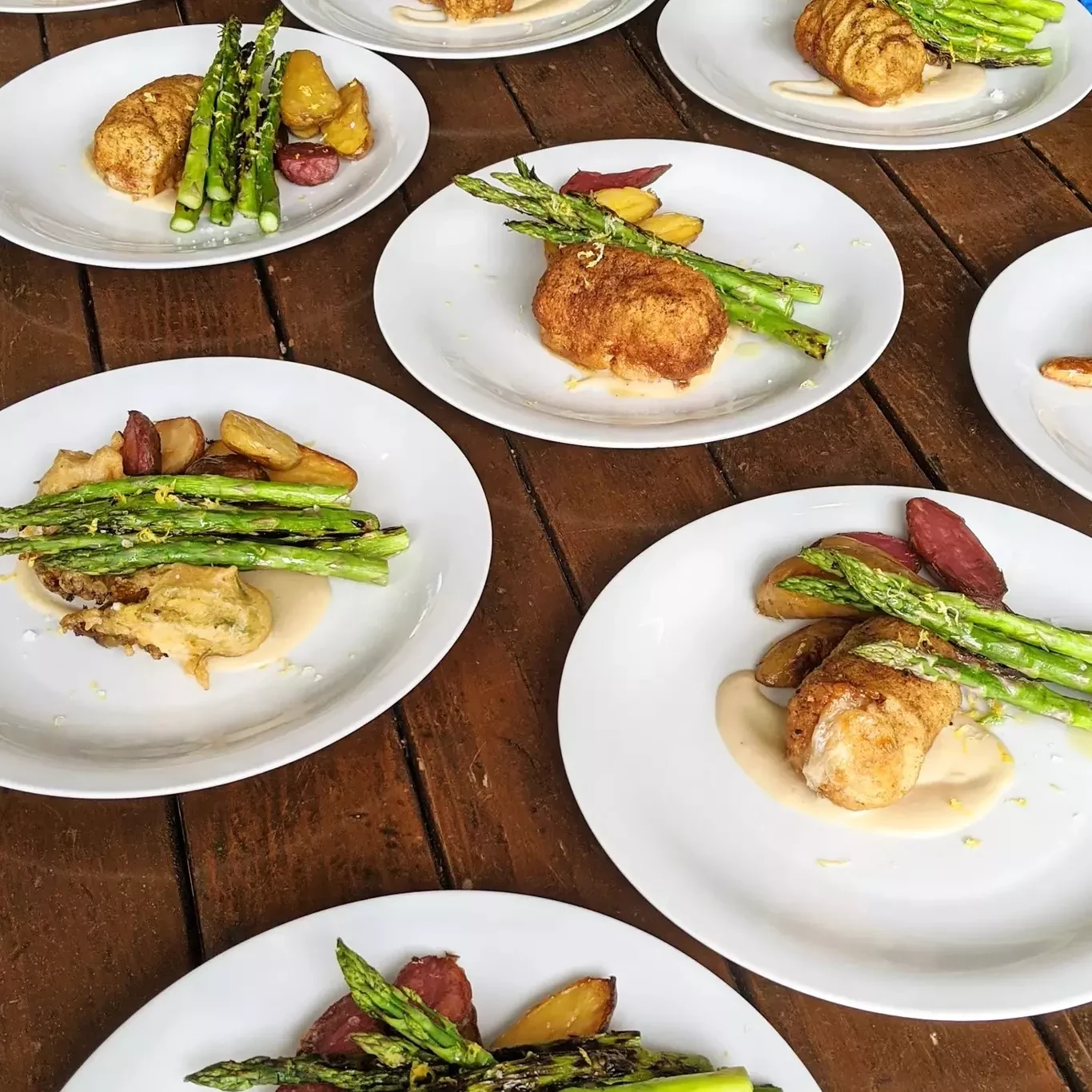 Plated chicken with asparagus and roasted potatoes